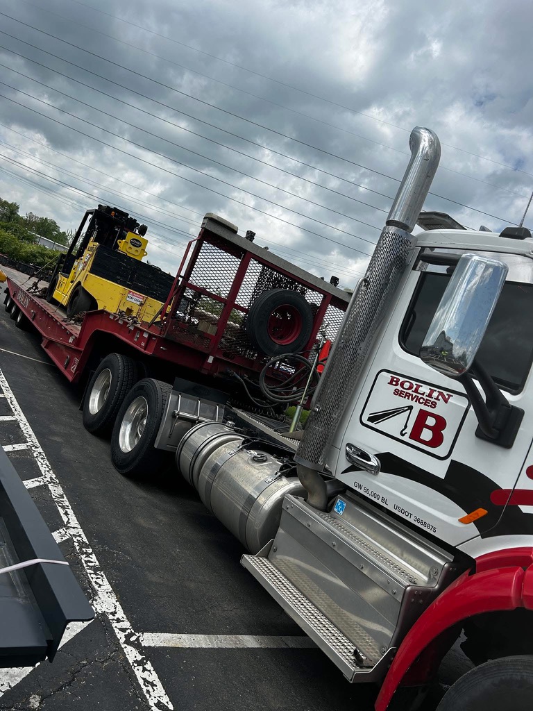 Bolin Services hauling equipment for a loyal customer.
